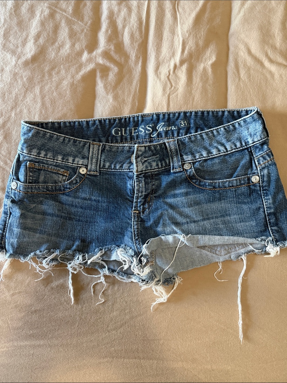 Guess Denim Cutoff Shorts in Medium Blue with Frayed Hem